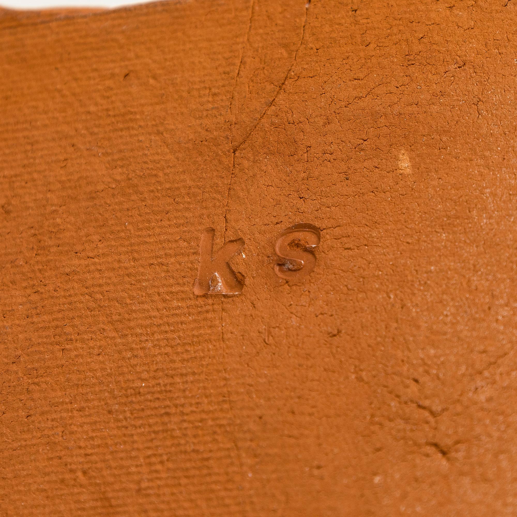 Kyllikki Salmenhaara, a 'winding' red clay sculpture, signed KS.