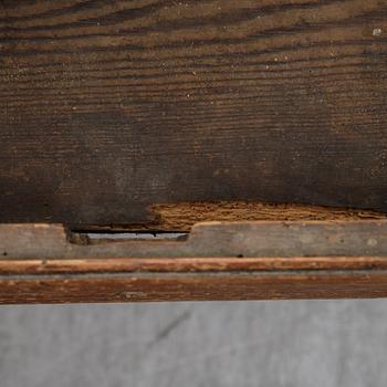 A 19th Century table with drawers.