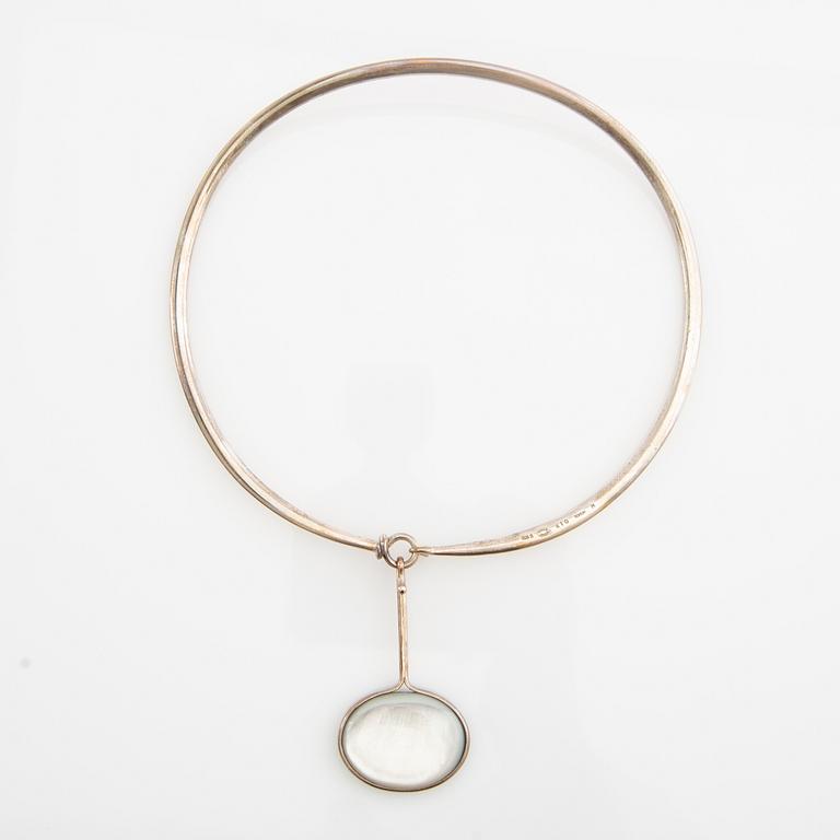 Vivianna Torun Bülow-Hübe, Necklace with pendant and a pair of earrings by Georg Jensen, Denmark, sterling silver and stone.