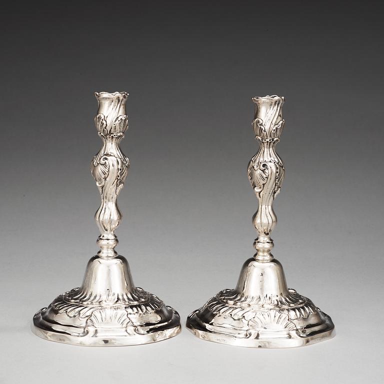 A pair of German mid 18th century silver candelsticks, marked IHG, probably Göttingen.