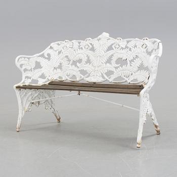 A WHITEPAINTED EARLY 20TH CENTURY SWEDISH AGGENBERG CAST IRON AND WOOD GARDEN SOFA.