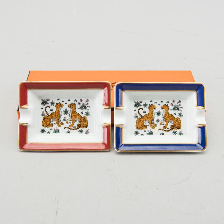 HERMÈS, a pair of porcelain ashtrays.