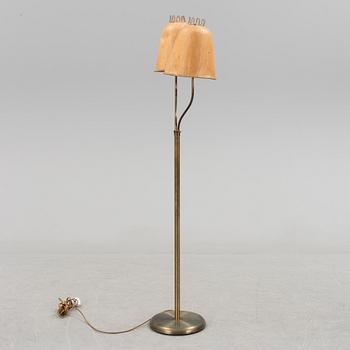 A brass floor lamp, mid 20 th century.