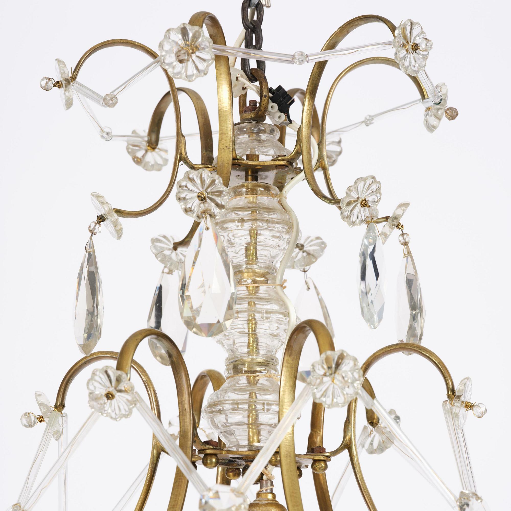 A seven-light gilt brass and cut glass rococo chandelier, mid 18th century.