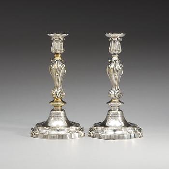 A pair of French Louis XV argent haché candelsticks, marked with C couronné (1745-49).