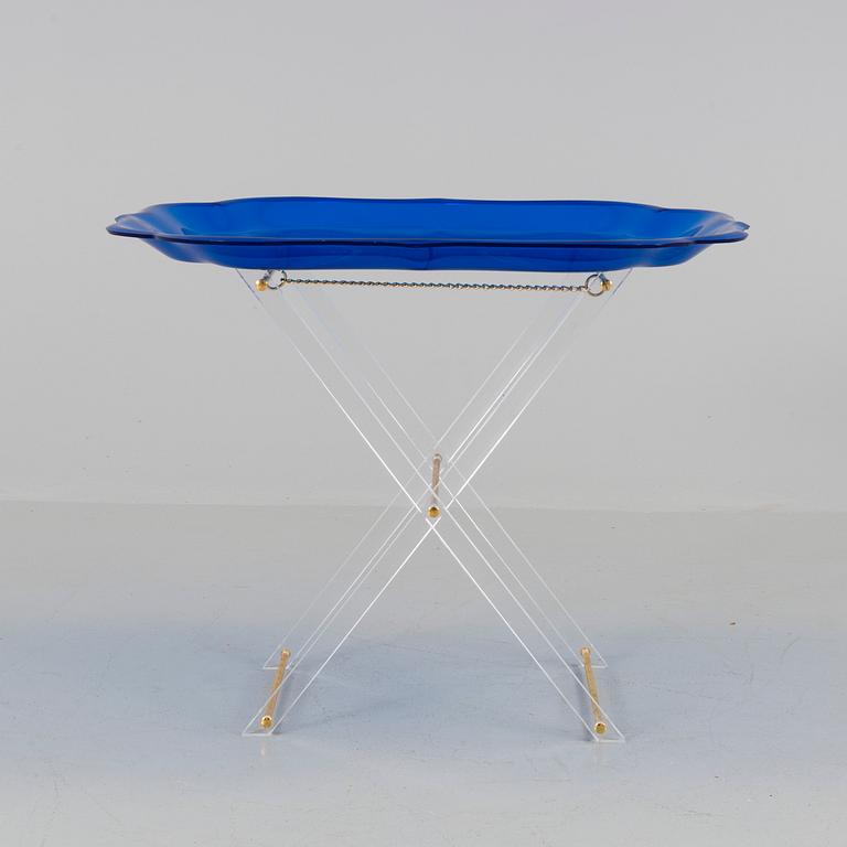 A plastic tray table, probably from Spisani, Italy.