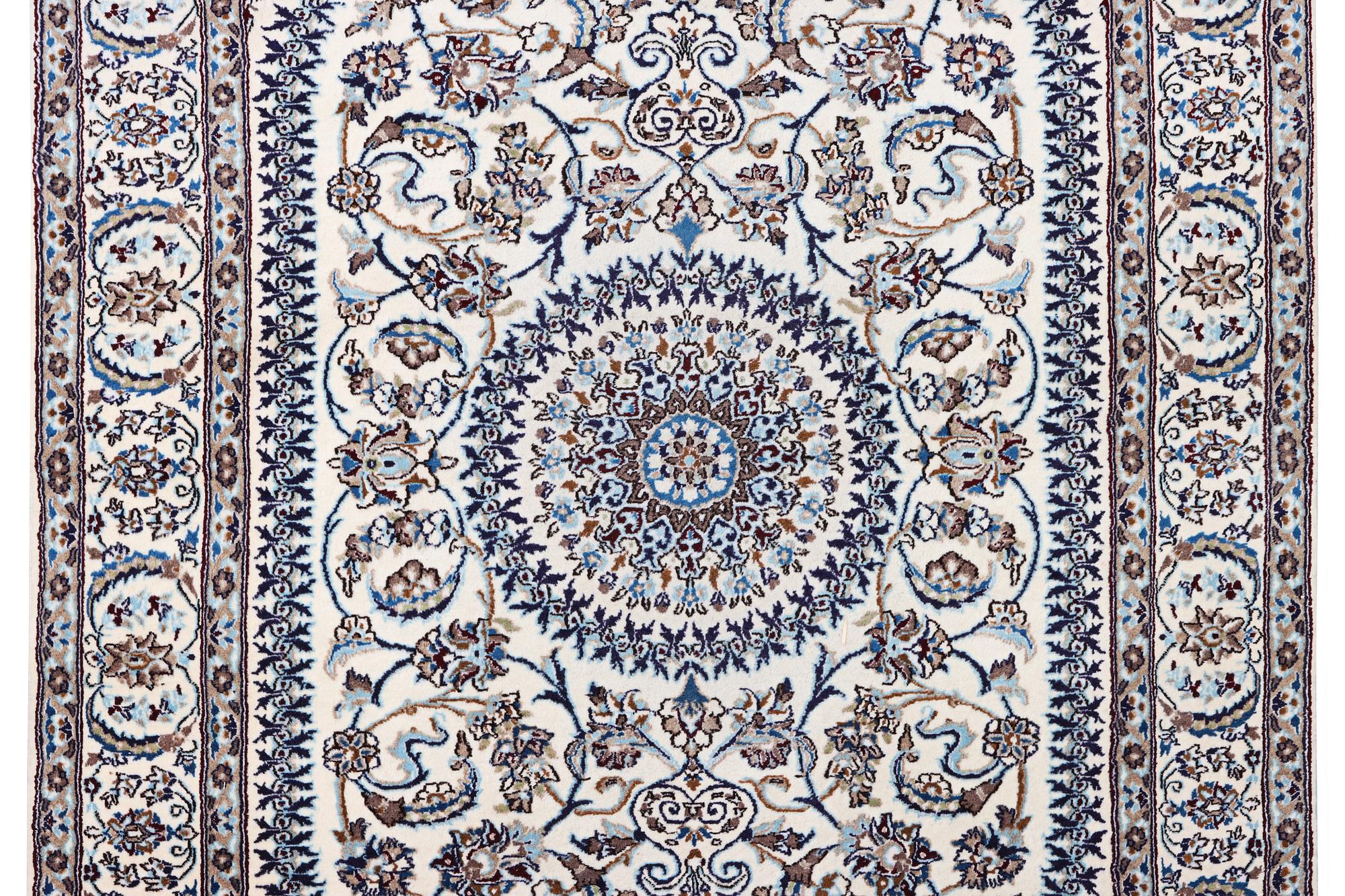 A Nain carpet, part silk, c. 291 x 201 cm.
