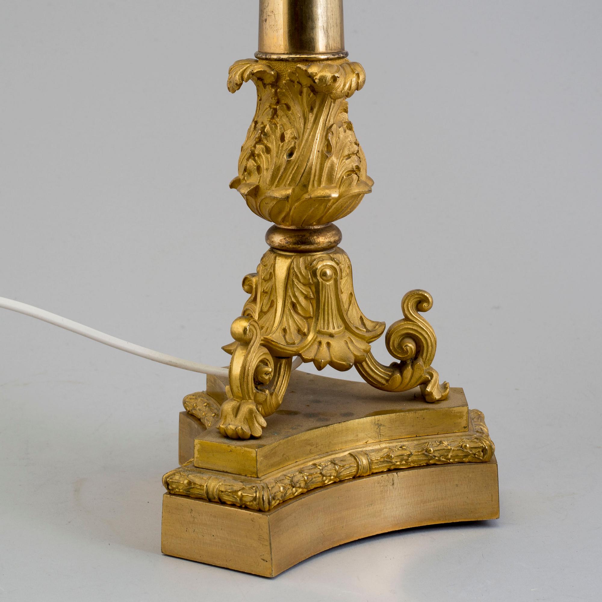 A LATE EMPIRE ORMOLU TABLE LAMP, mid 19th century.