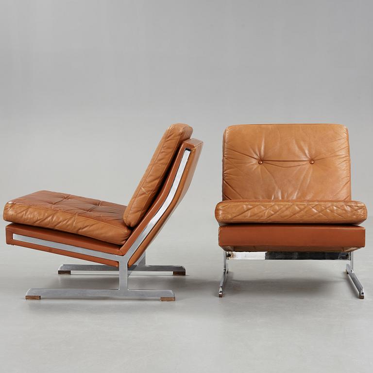 A pair of Poul Nørreklit chromed steel and brown leather easy chairs, Selectform, Denmark 1960's.