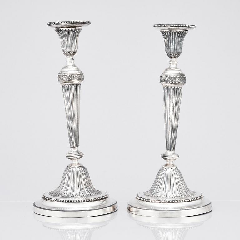 A pair of Swedish Gustavian silver candlesticks, marks of Mikael Nyberg, Stockholm 1790 and 1791.