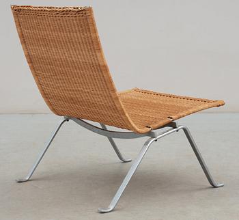 A Poul Kjaerholm steel and ratten 'PK-22' easy chair, E Kold Christensen, maker's mark in the steel.