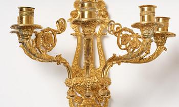 A pair of French 19th century gilt bronze five-light wall-lights.