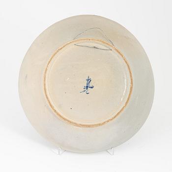 A ceramic dragon dish, Sout East Asia, 20th century.