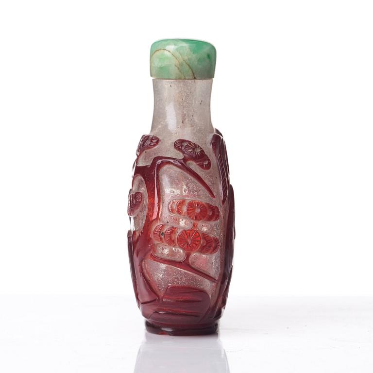 A peking glass snuff bottle with stopper, Qing dynasty, 19th Century.