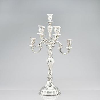 A pair of eight-light Louis XV-style silver candelabra, mark of Hermann Julius Wilm, Berlin, circa 1900.