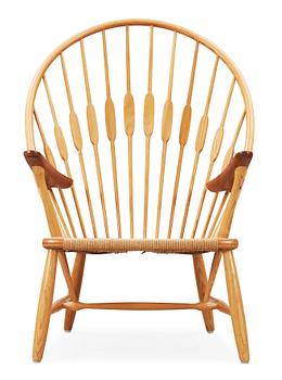 A Hans J Wegner ash and teak 'Peacock chair', Johannes Hansen, Denmark.