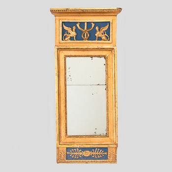 A gilded and bronzed Empire mirror, first half of the 19th century.