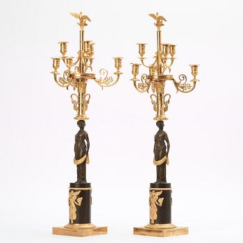 A pair of Empire early 19th century six-light candelabra.