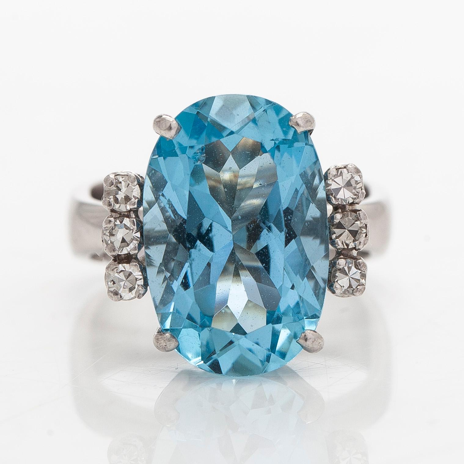 An 18K white gold ring with aquamarine and brilliant-cut diamonds, Conti, South Africa.