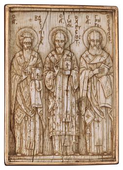 628. A probabaly Byzantine (Middle Ages to 1453) ivory icon/relief depicting Basileios, Chrysostomus and Gregorius.