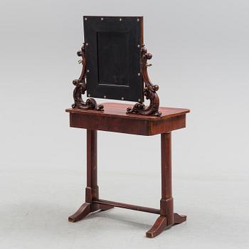 A mid 19th century late empire dressing table.