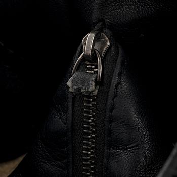 Bottega veneta, a black leather bag.