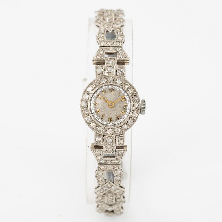 Damarmbandsur, platina med åttkantslipade diamanter, med textilrem.