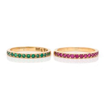 Two 18K gold rings set with faceted rubies and emeralds.