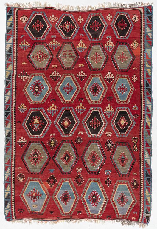 An antique/semi-attique kelim carpet, c. approx. 320 x 222 cm.