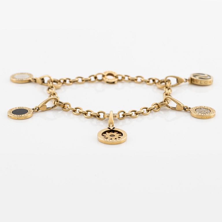 Bulgari, bracelet, with 5 charms (detachable), 18K gold, white gold, onyx, mother-of-pearl, and brilliant-cut diamonds.