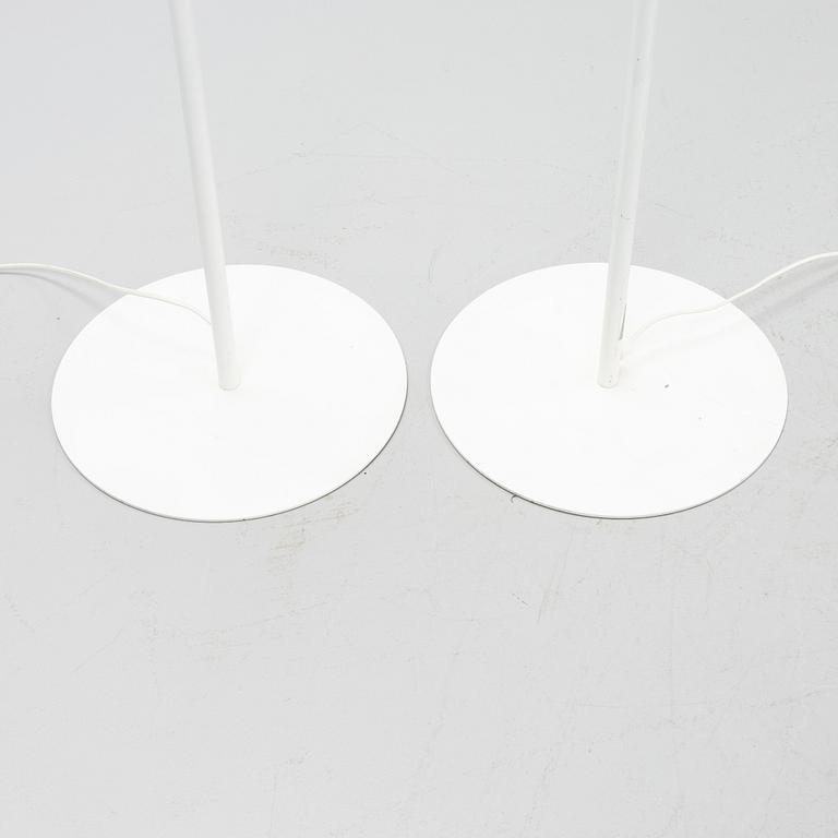 A pair of whithe floor lights, Luxus, Vittsjö.