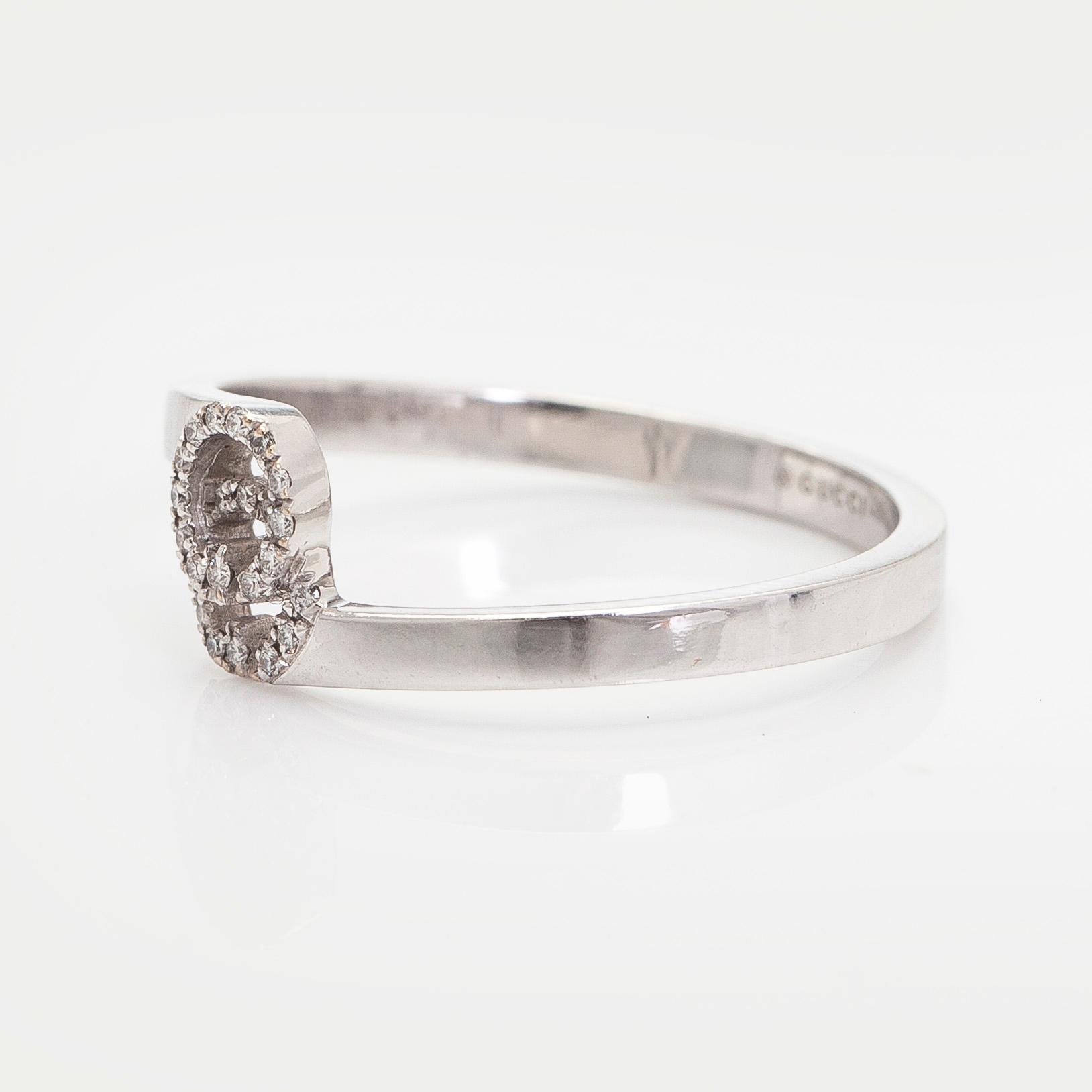 Gucci, an 18K white gold 'GG Running' ring with diamonds.