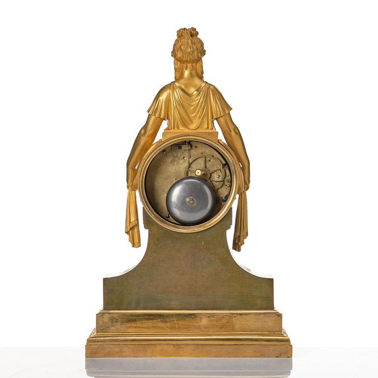 An Empire bronze mantle clock.