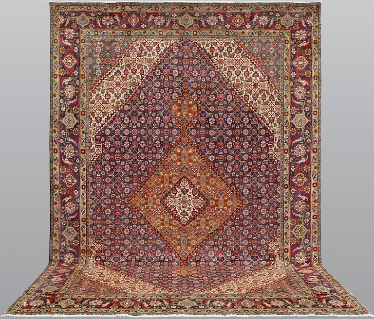 A Tabriz carpet, approximately 360 x 255 cm.