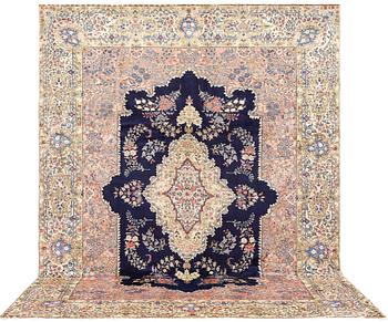 A semi-antique Kerman carpet, approximately 358 x 268 cm.
