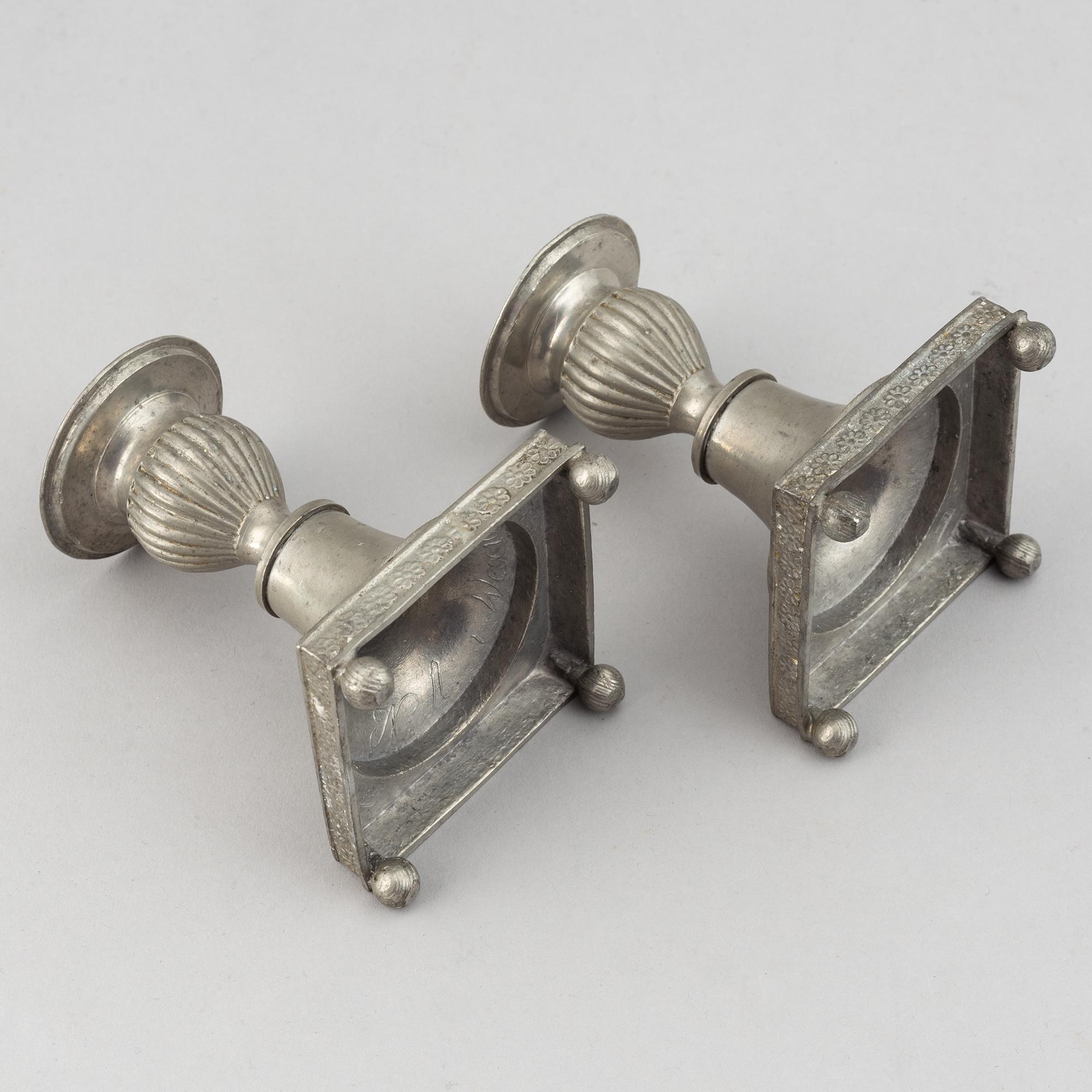 A pair of pewter candlesticks by Niclas Anström, Växjö 1835.