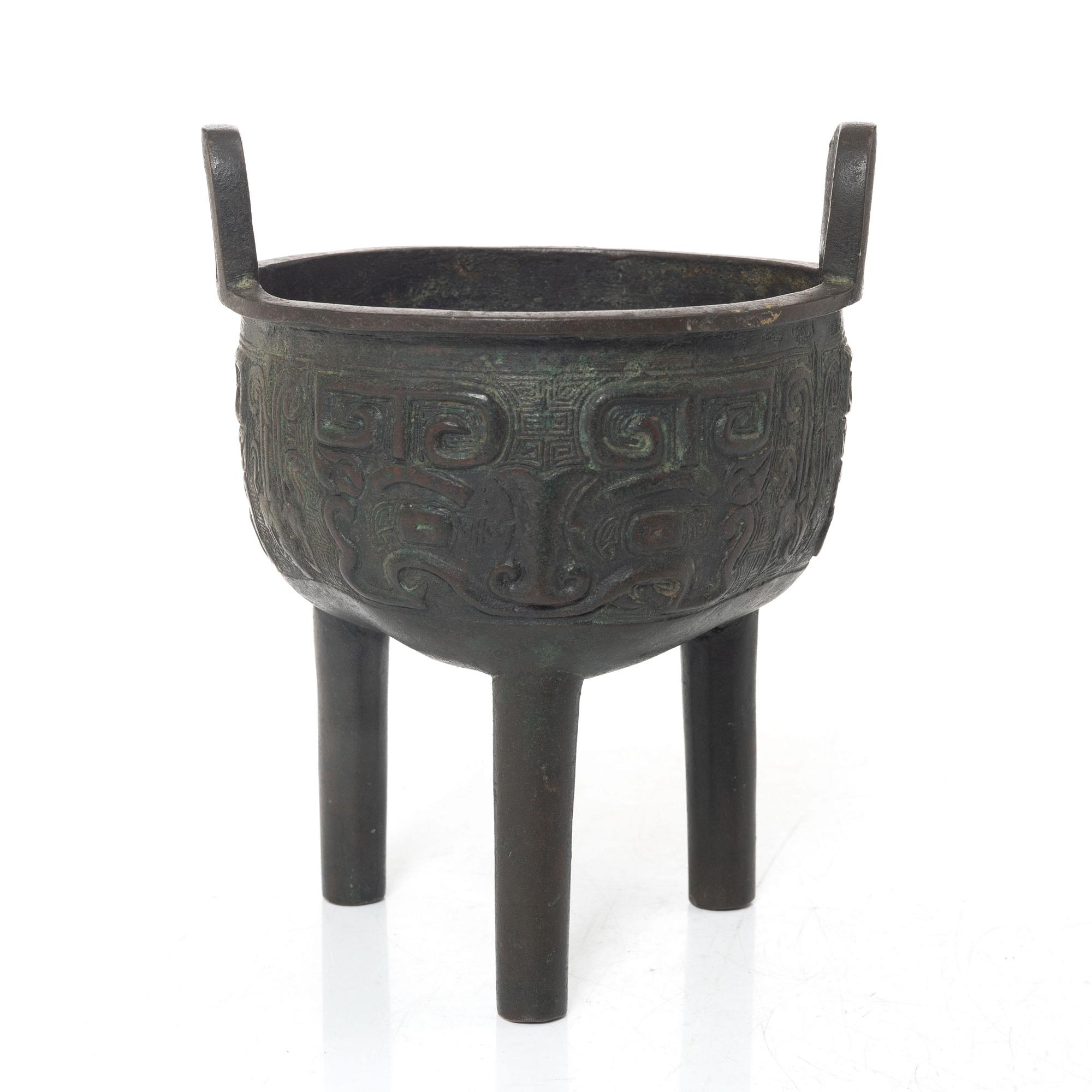 A Chinese tripod bronze censer, Ming style, Qing dynasty (1644-1912).