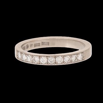 An 18K white gold half eternity ring set with round brilliant-cut diamonds.