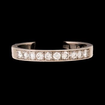 An 18K white gold half eternity ring set with round brilliant-cut diamonds.