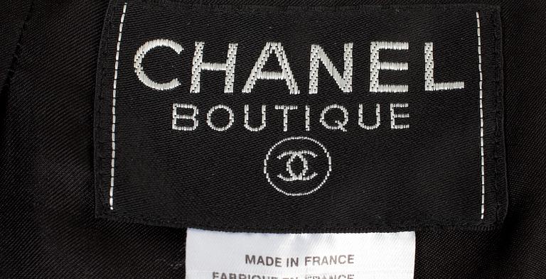 A two-piece Chanel suit, autumn 1998.