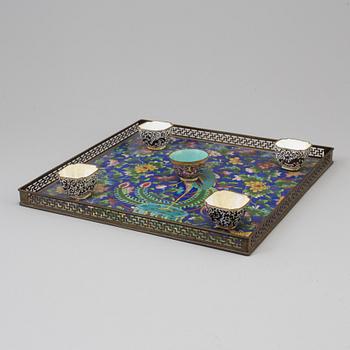 A chinese cloisonné tray, 20th century, and five enamel on copper cups, late 19th/early 20th century.
