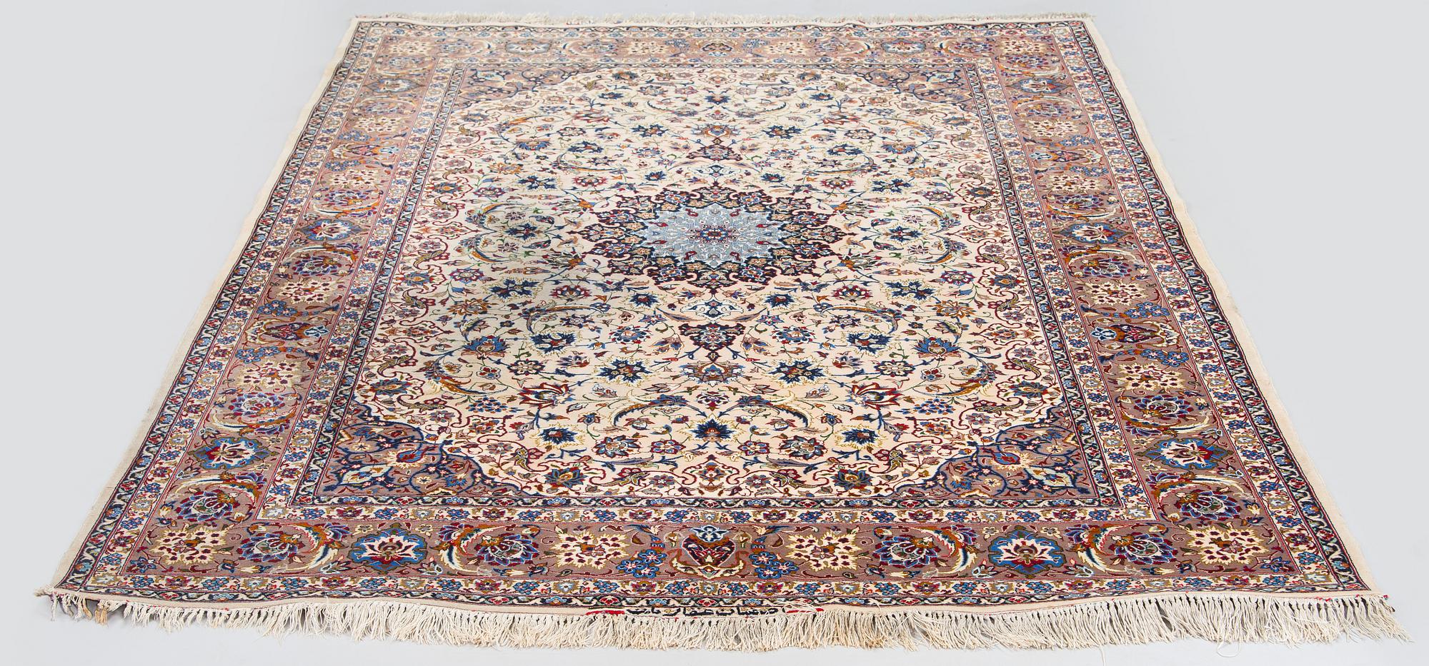 A semi-antique Isfahan rug, central Persia, signed c. 238 x 165 cm.