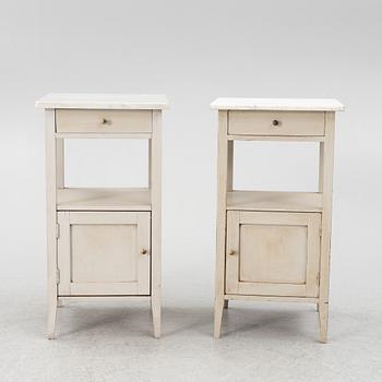 A matched pair of bedside tables.