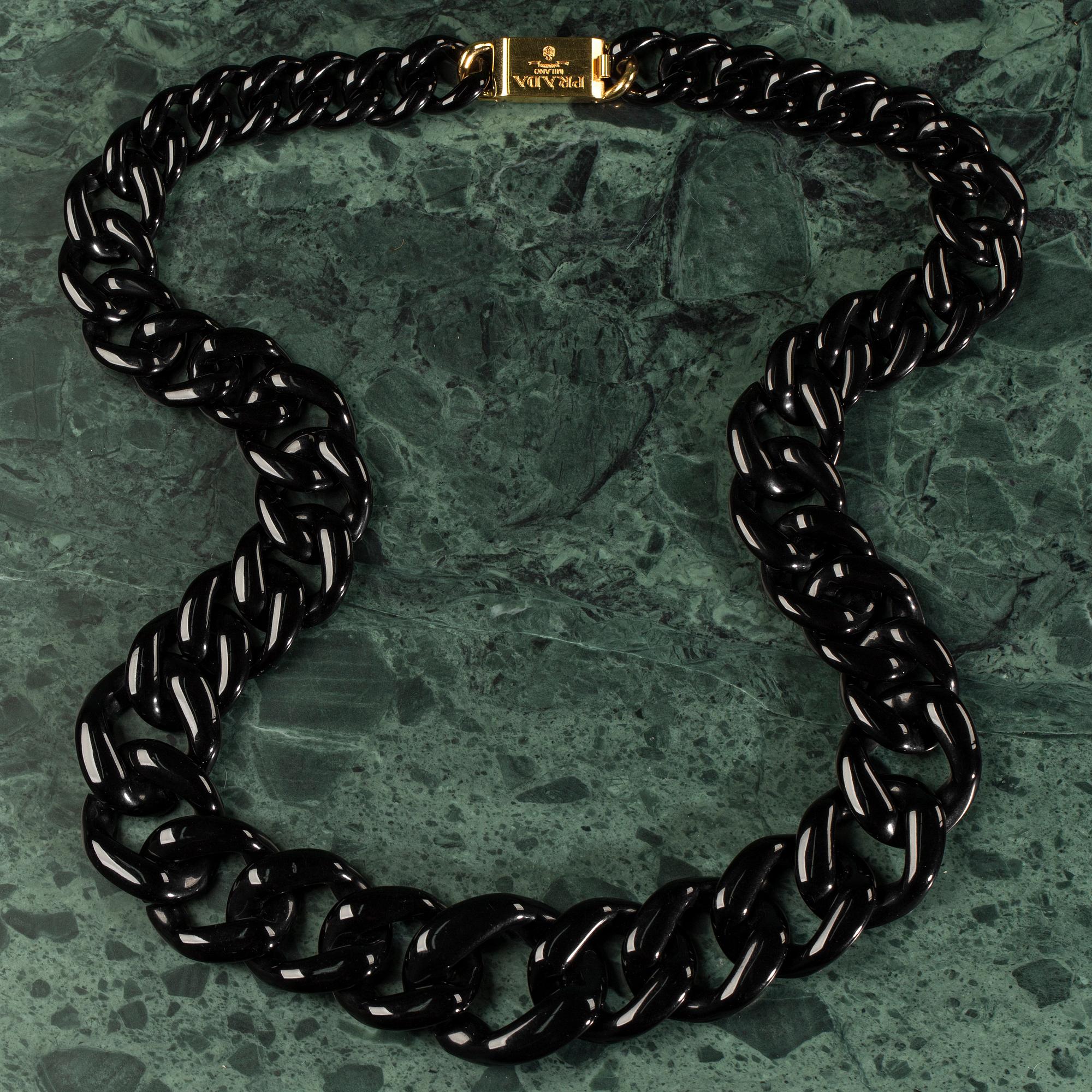 A necklace by PRADA.