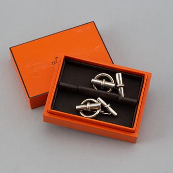 HERMÈS, a pair of silver cuff links.