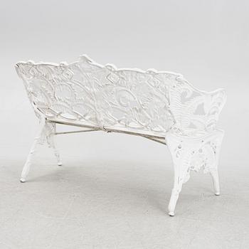 A garden sofa, early 20th Century.