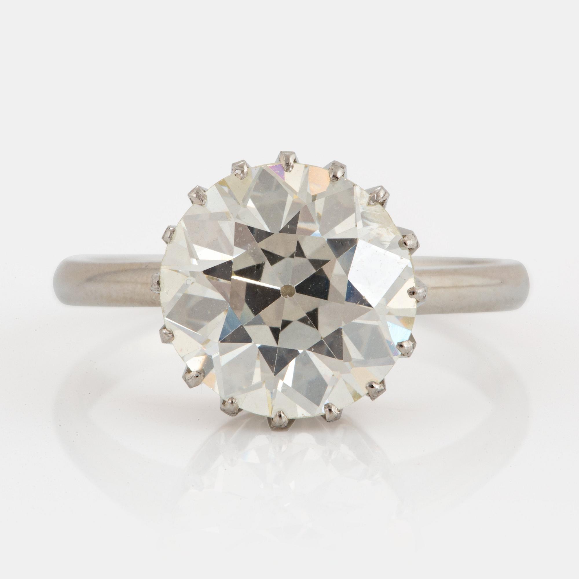 An 18K white gold ring set with an old-cut diamond ca 3.80 cts quality ca J/K vs.