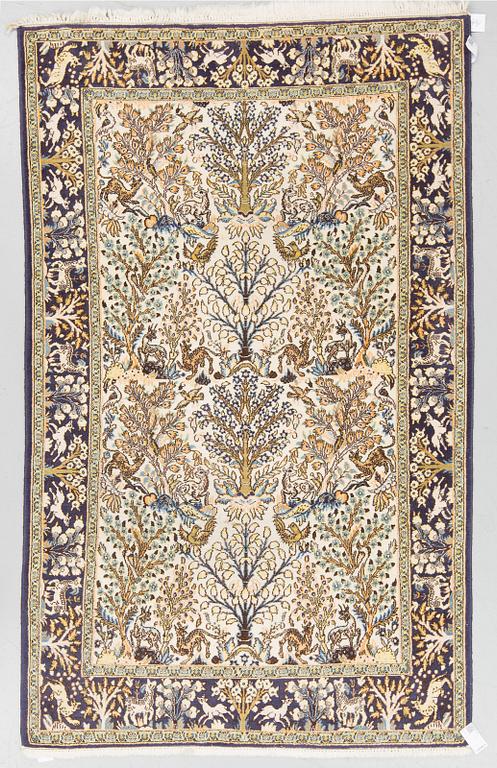 AN OLD RUG FROM QUM, around 222 x 133 cm.