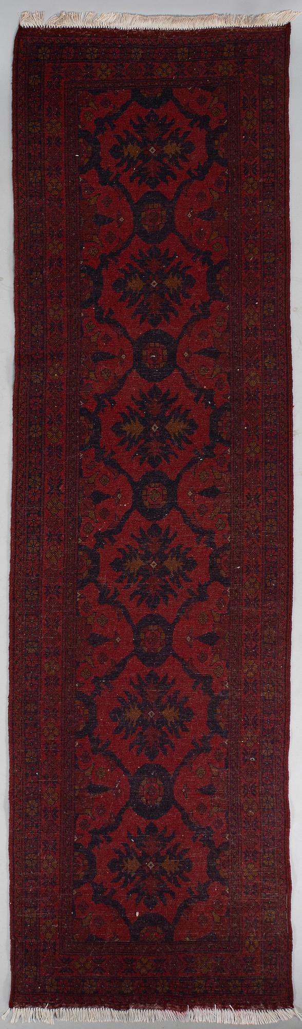 An Afghan runner, ca. 295 x 82 cm.