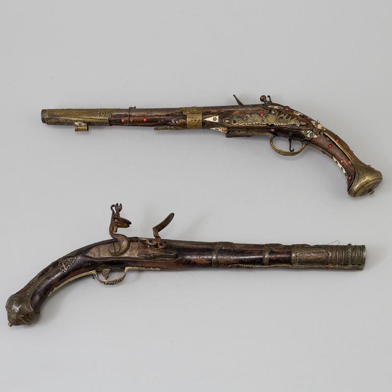 Two 19th century flintlock pistols.